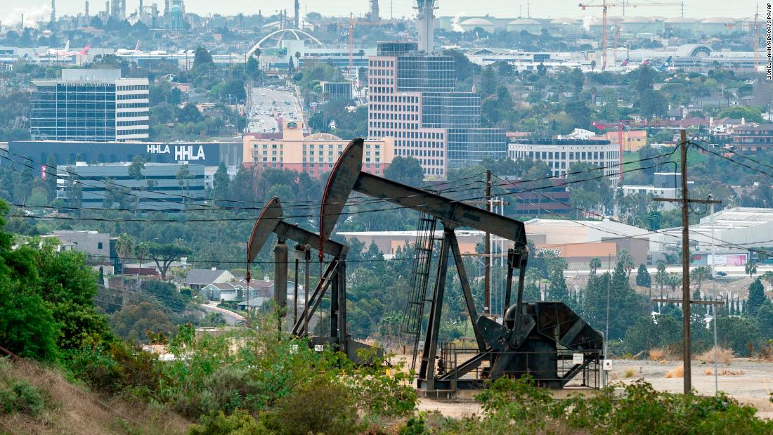 Pump jacks draw crude oil from the Long Beach Oil Field near homes in Signal Hill, California, on March 9, 2022. - Global stocks and oil prices rebounded on March 10, 2022 on hopes of US economic stimulus efforts as the coronavirus rages, one day after suffering their biggest losses in more than a decade. Trading is exceptionally volatile as investors attempt to get a grip on a rapidly changing news flow, with positive reports of progress in China on the virus clashing with a Saudi decision to increase oil output in an already over-supplied market. (Photo by David McNew/AFP/Getty Images)