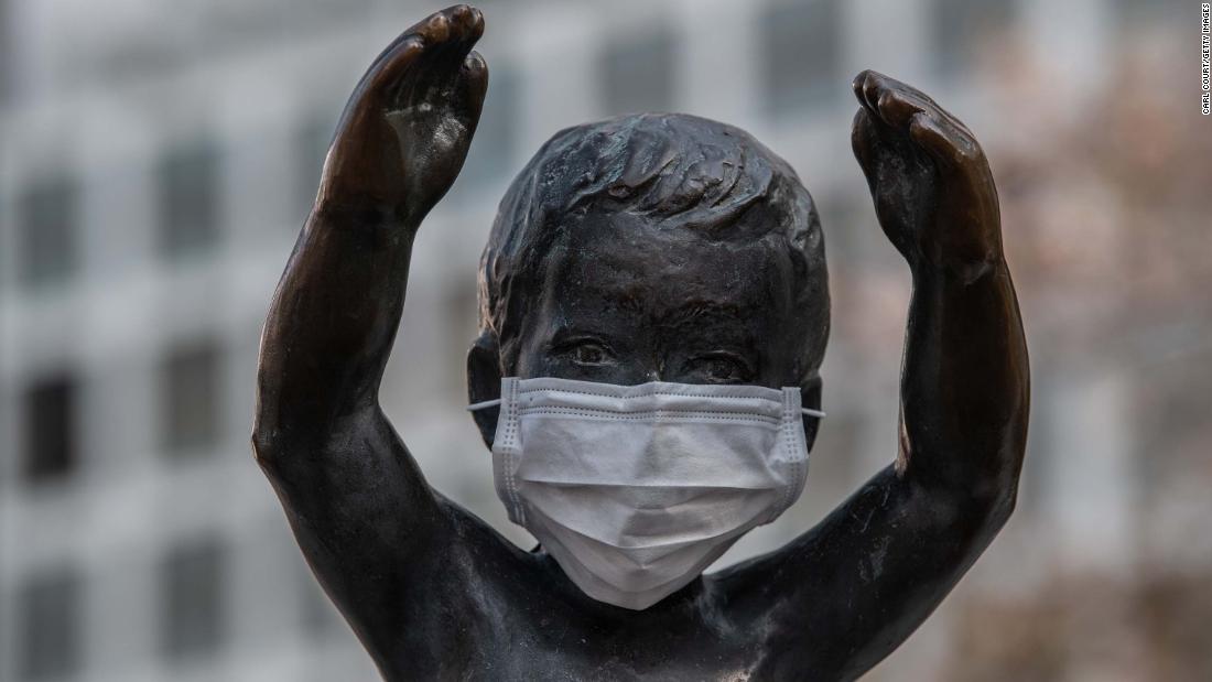 A statue of a small boy is pictured with a face mask on April 8, 2023 in Tokyo, Japan.
