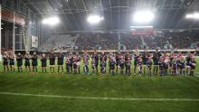 Il team Otago Highlanders si è schierato prima dell'inizio della partita al Forsyth Barr Stadium di Dunedin, il primo da quando le restrizioni su Covid-19 sono state ampiamente revocate in Nuova Zelanda.