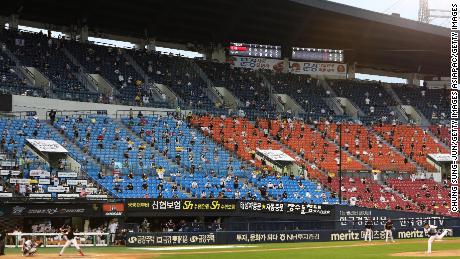 Baseball fans watch on from the stands during the KBO League game between LG Twins and Doosan Bears.