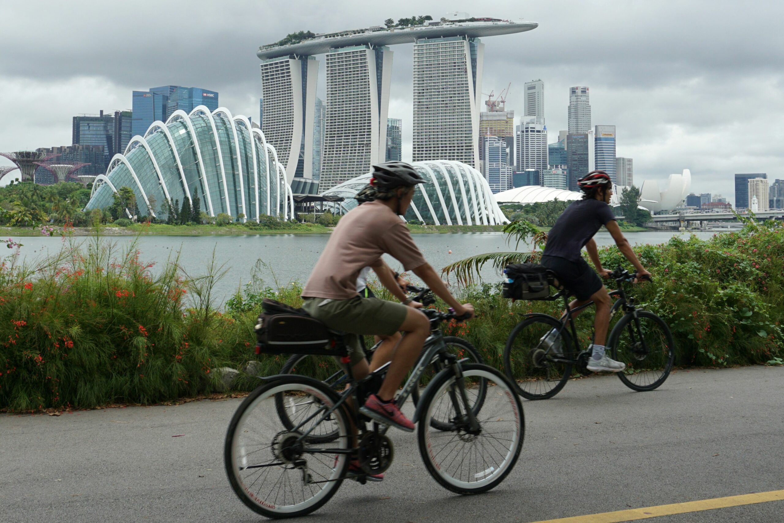 Cyclists riding along Marina Bay overlooking the financial business district in Singapore on July 14.